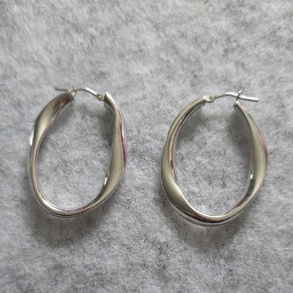 Silver Toned Wavy Oval Hoop Earrings